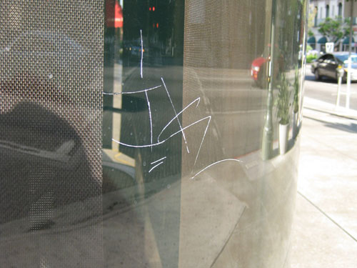 Curve Glass Before Scratch Graffiti Removal by GlassRenu