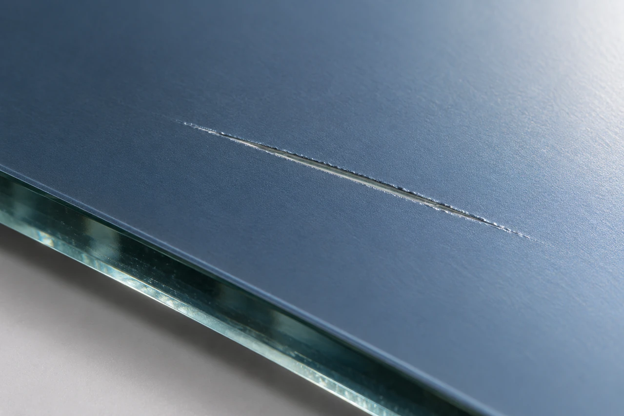 Isolated scratch through a reflective coating