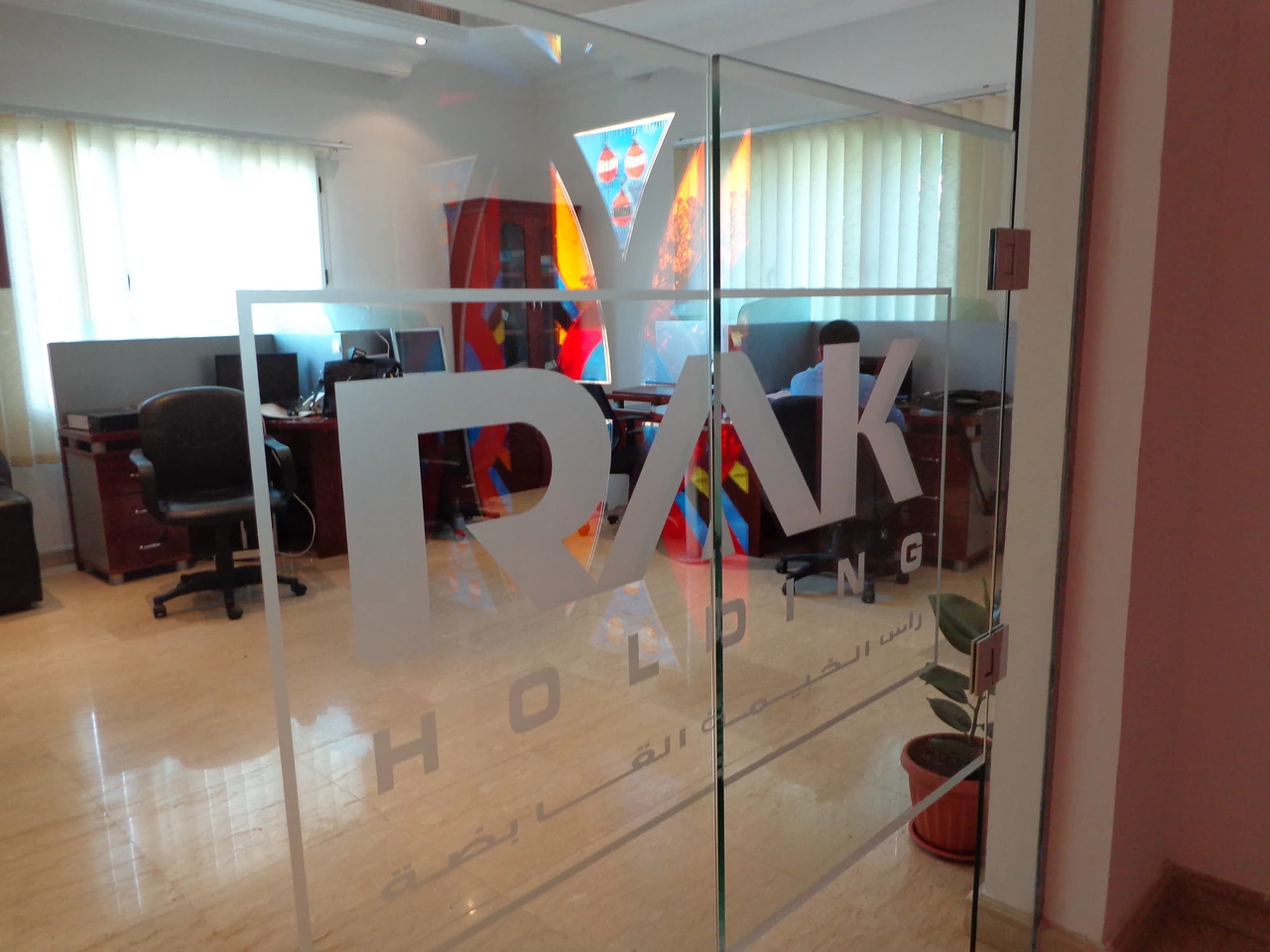 Glass door with localized fittings