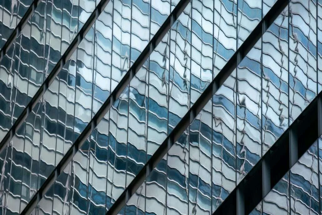 Reflected façade lines distorted by glazing
