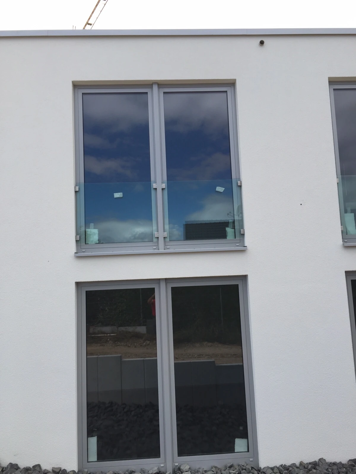 Glass guard at a French window; application context, not verification of engineering or load capacity.