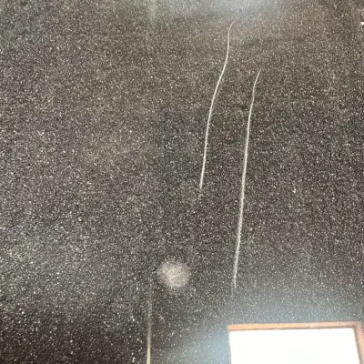 Linear glass-on-glass scratch/scuff — current GlassRenu field photo